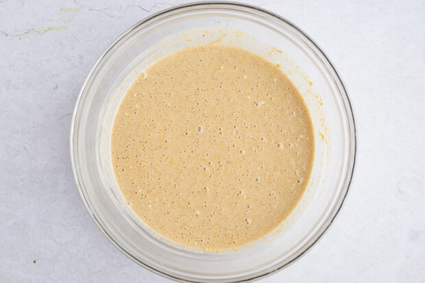 Sweet potato pancake batter in large glass mixing bowl