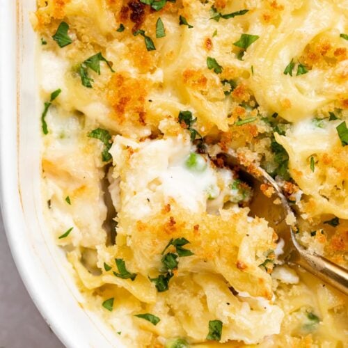 overhead image of turkey casserole being scooped out of a baking dish.