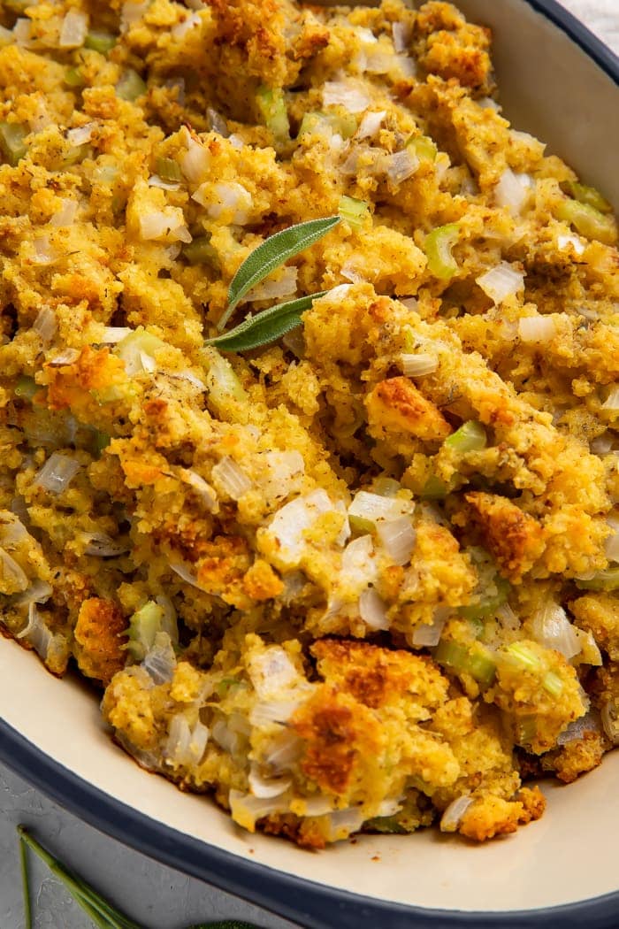 Cornbread stuffing in a large blue casserole dish