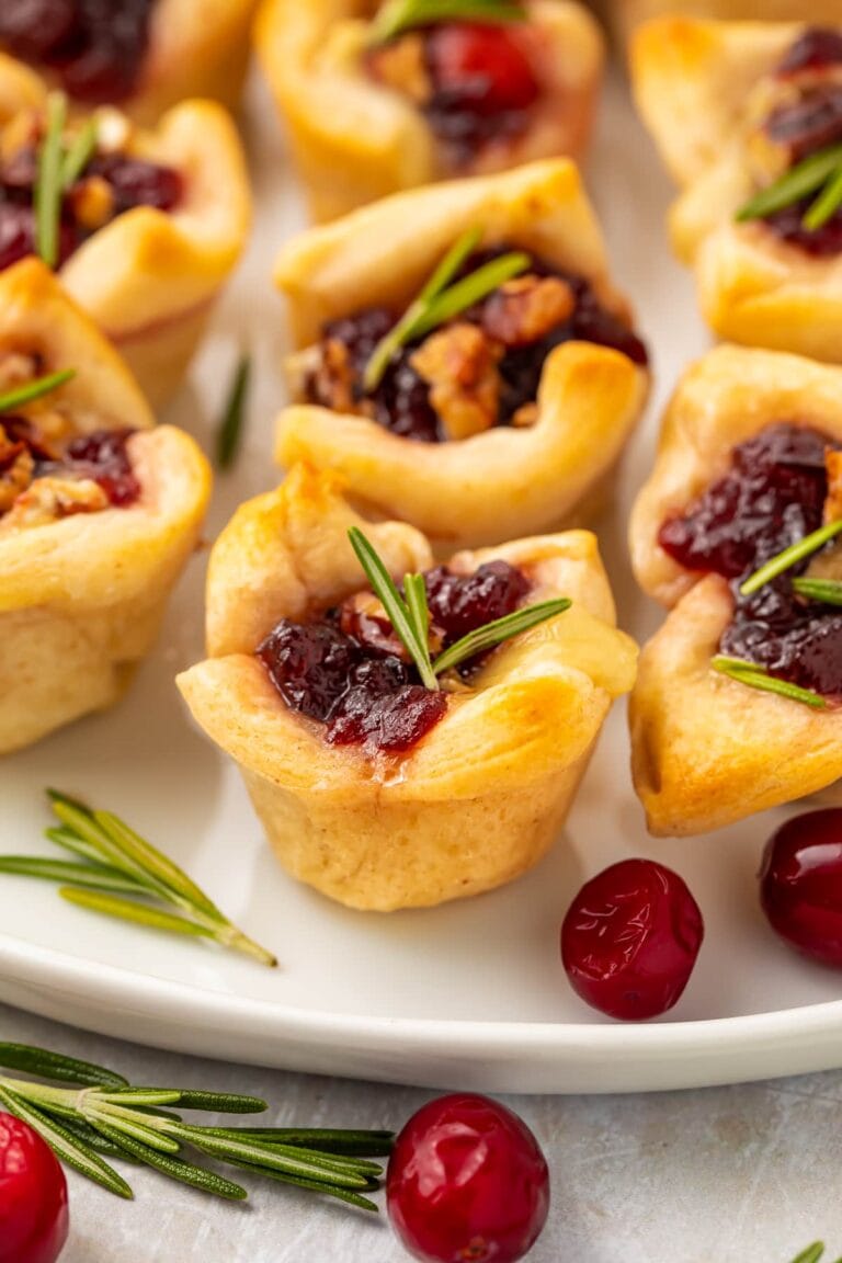 Cranberry brie bites on a serving platter.