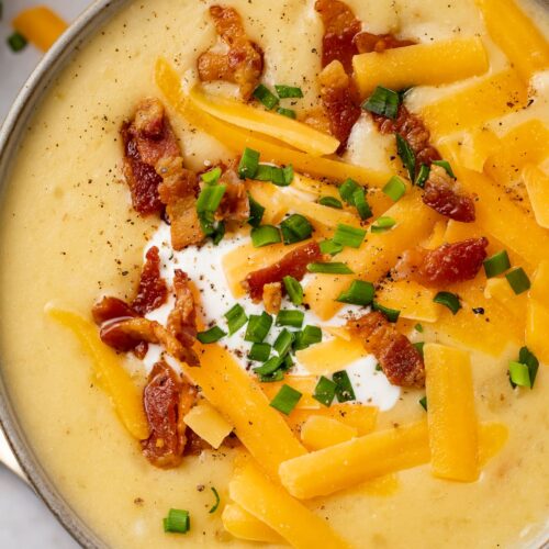 Overhead view of Instant Pot potato soup in black soup bowls