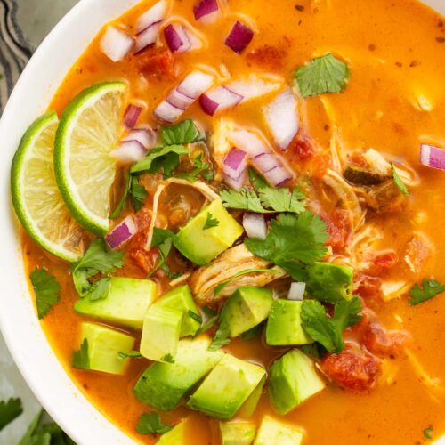 A close-up of a bowl of Whole30 chicken tortilla-less soup on a table.