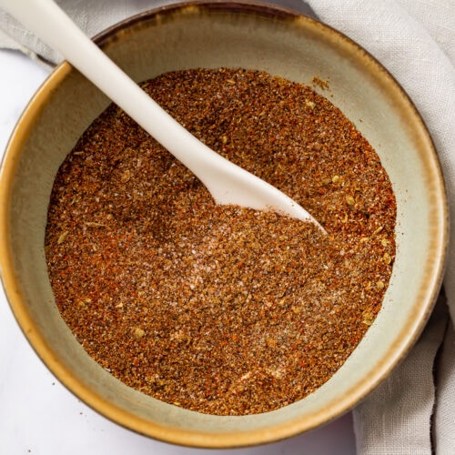 Keto taco seasoning in a bowl with a white spoon