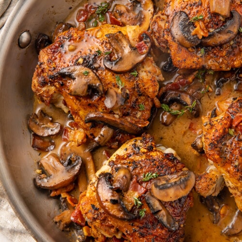 Whole30 Mushroom bacon chicken thighs in a skillet