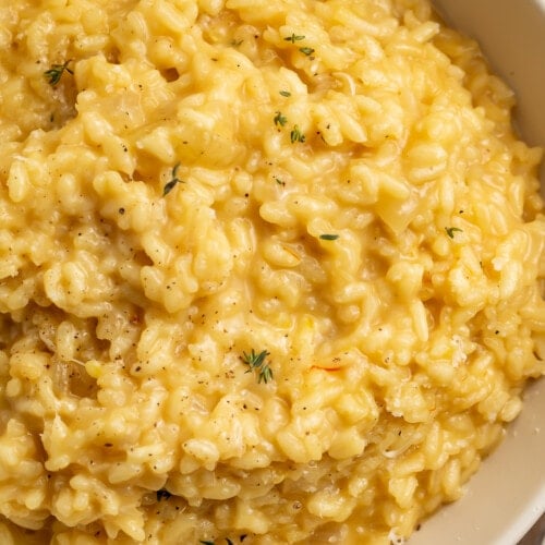 Close up view of risotto in a ceramic bowl