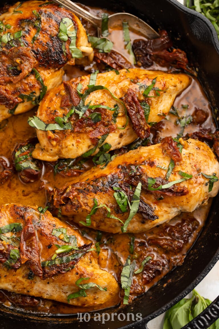 Overhead view of Whole30 Marry Me Chicken in a cast-iron skillet