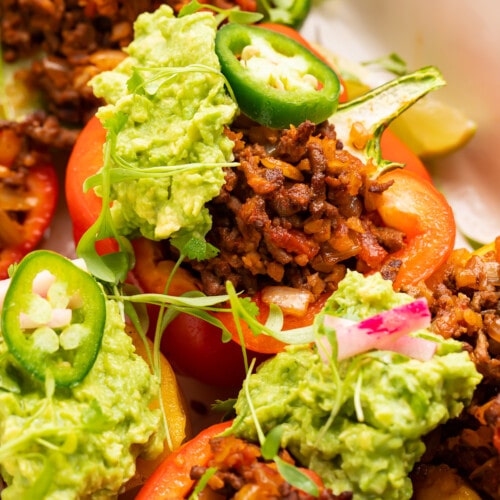 Close-up view of Whole30 taco stuffed peppers in a baking dish