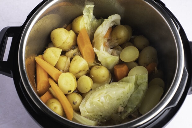 Potatoes, carrots, and onions in Instant Pot.