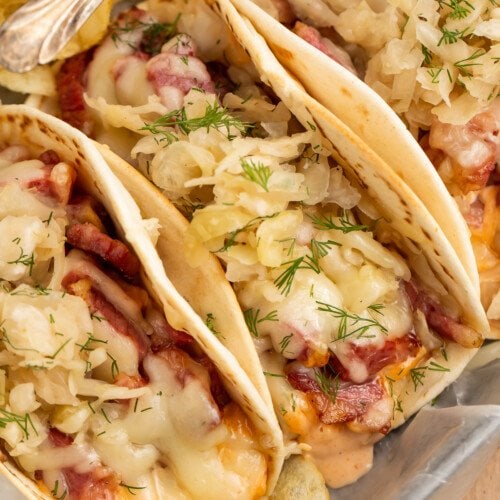 Overhead closeup view of 3 reuben tacos side-by-side