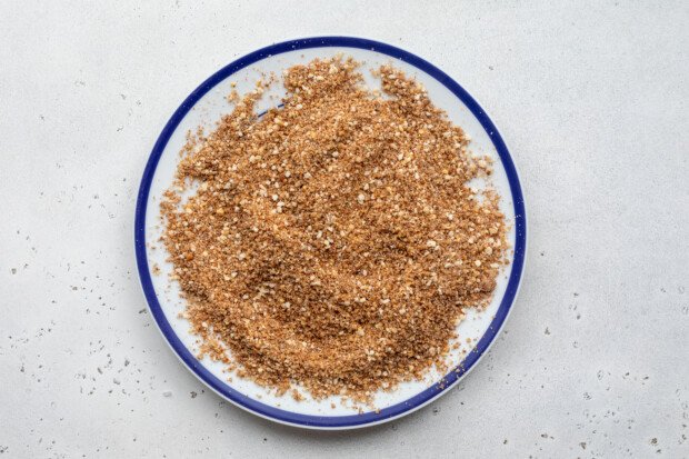 Overhead view of the pecan and breadcrumb mixture for coating the chicken cutlets.