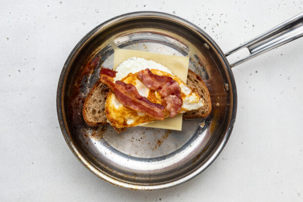 Fried egg sandwich in large skillet.