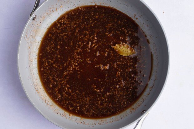 Ingredients for BBQ shrimp sauce in large skillet.