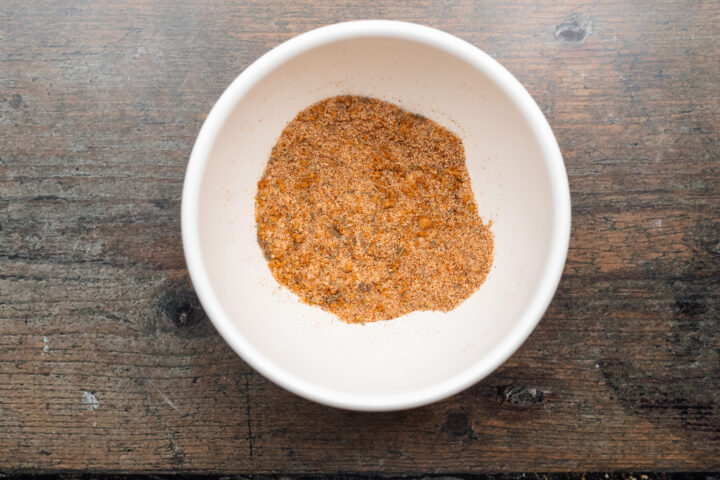 Spice blend for sous vide brisket in a small white mixing bowl.