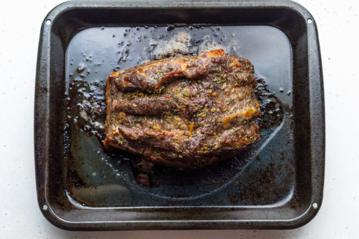 Overhead view of sous vide prime rib that's been seasoned with spices and roasted until deep brown.