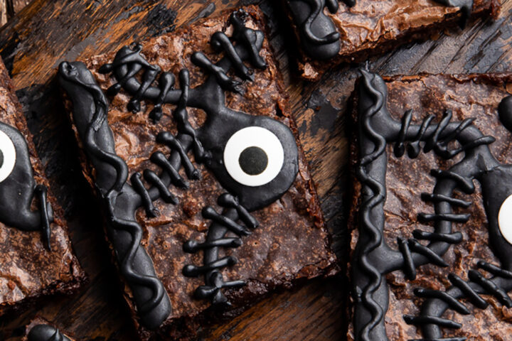 Close-up view of Hocus Pocus spellbook brownie decoration with icing and candy eye.