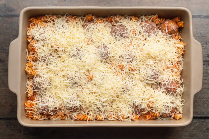 Overhead view of meatball casserole topped with mozzarella.