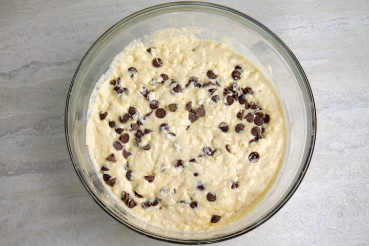 Chocolate chips folded into pancake batter, creating chocolate chip pancake batter.