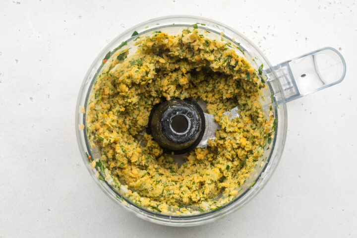 Falafel mixture in food processor bowl.