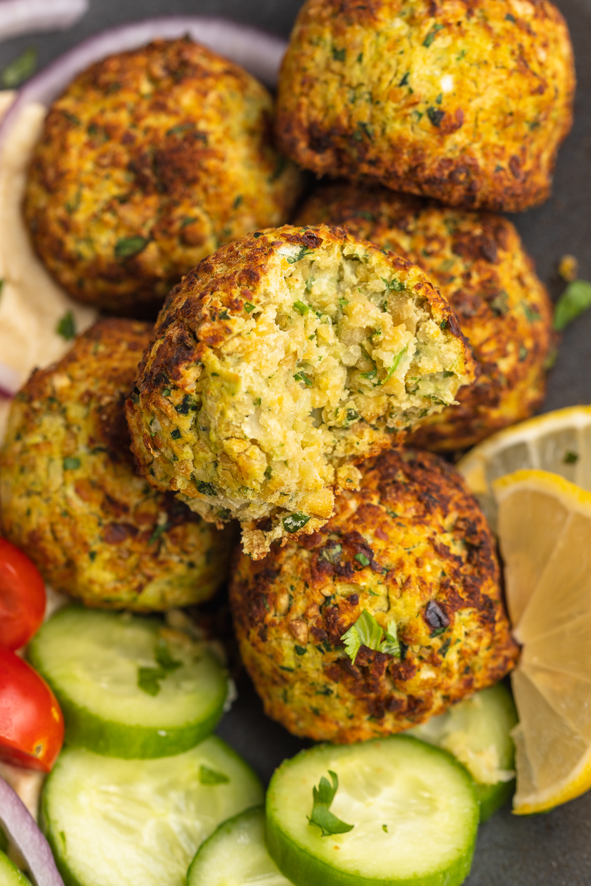 Close-up of air fryer falafel with a bite taken out.