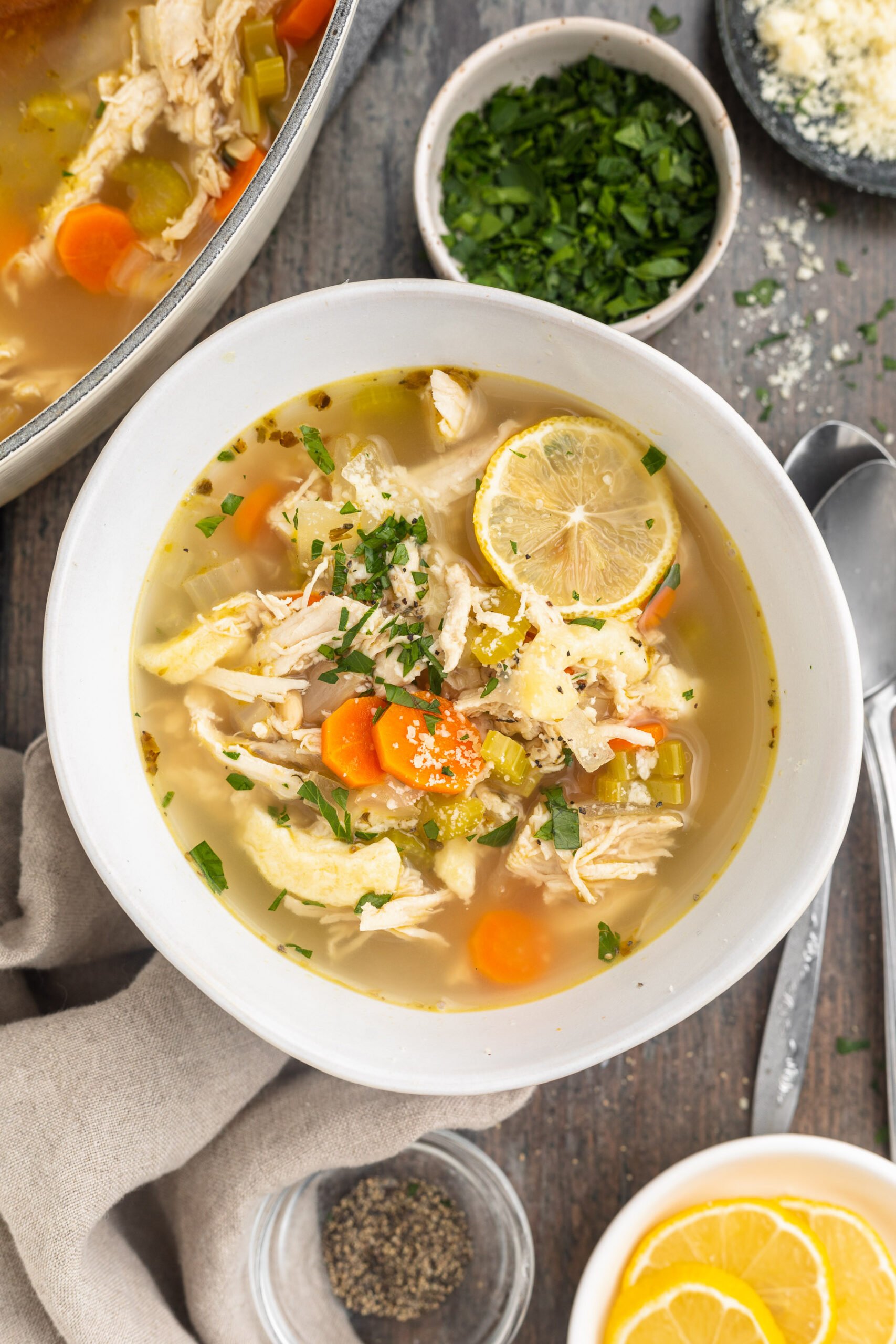 Top-down view of a bowl of keto chicken noodle soup.