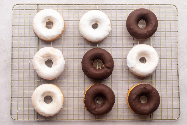 Glazed keto donuts resting on a wire cooling rack.