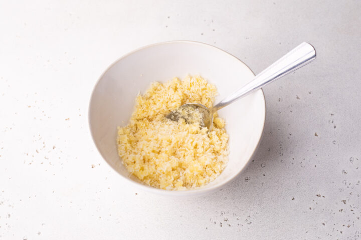 Breadcrumb topping in a white bowl before being added to lobster mac and cheese.