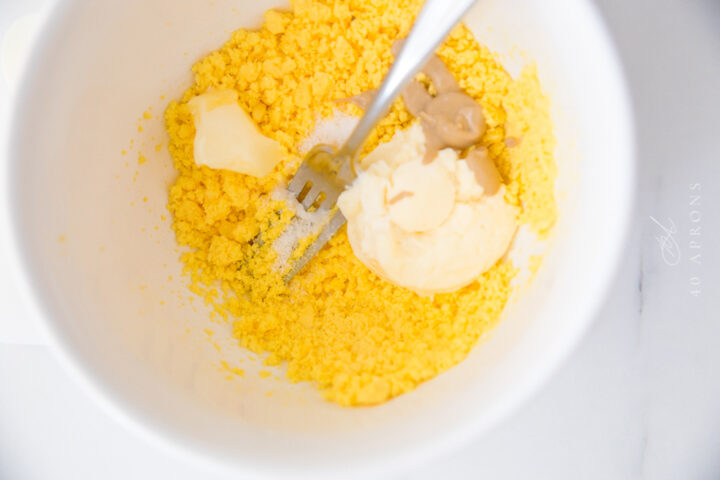 Egg yolk filling ingredients in large mixing bowl before being combined.