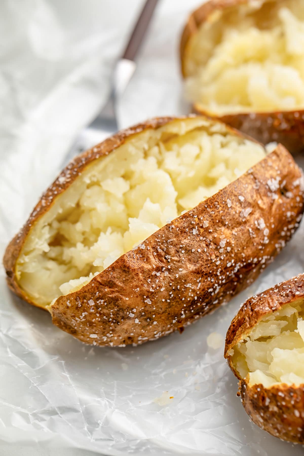 Air fryer baked potato, split down the center and fluffed.