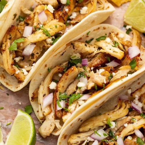 Close-up of a chicken carnitas taco with Instant Pot chicken carnitas.