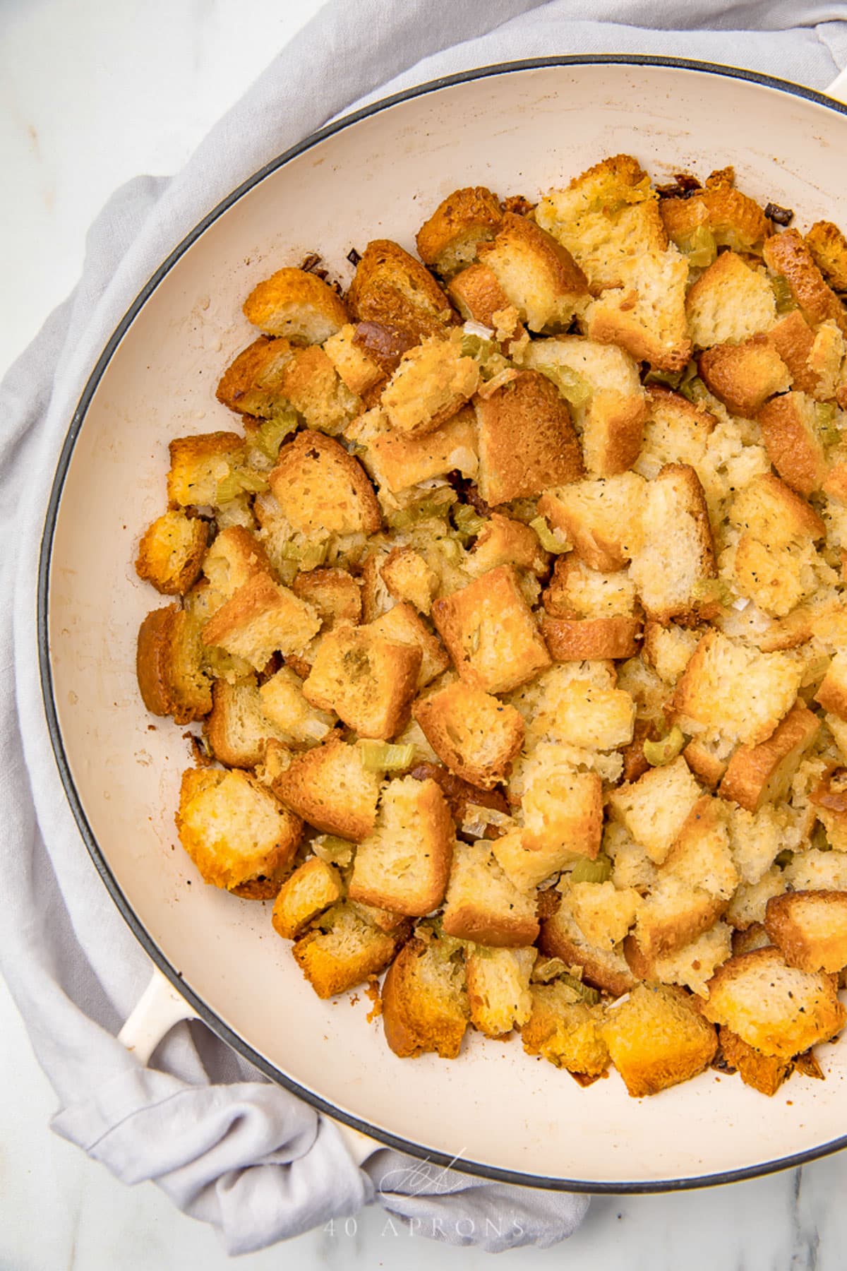 Gluten free stuffing in a large round casserole dish.