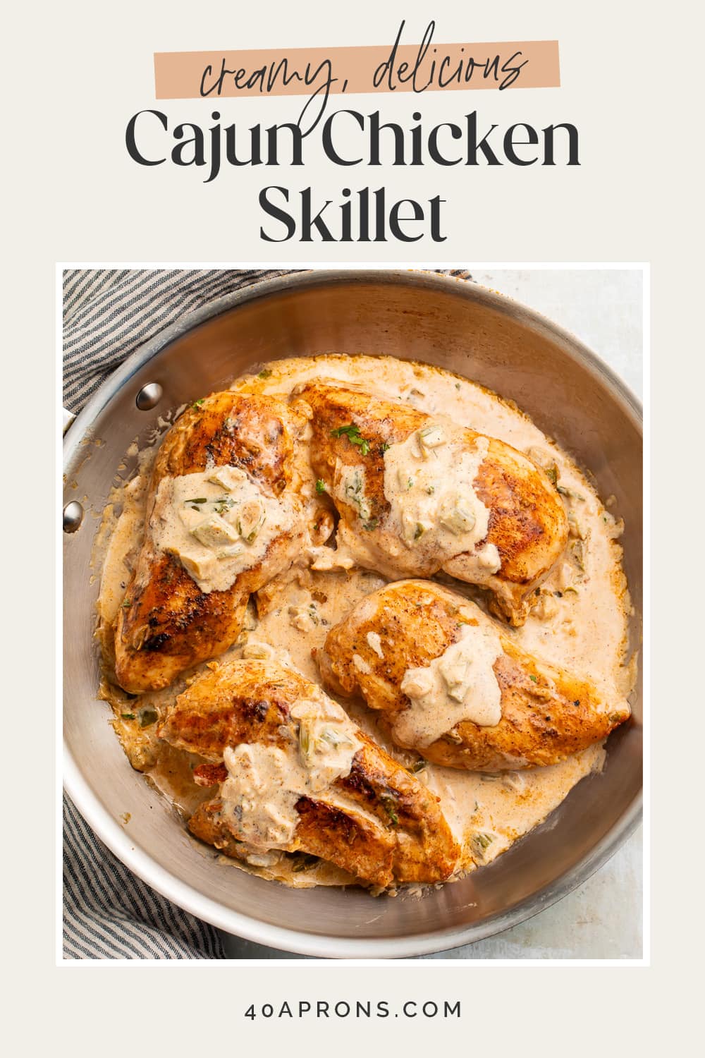 Pin graphic for creamy Cajun chicken skillet.